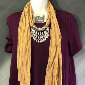 Jersey knit tan scarf with silver jewelry piece